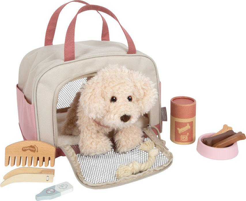 Hund mit Tasche und Pflege-Set
