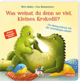 Kleines Krokodil Juli weint traurig, tröstender Papa gibt Halt